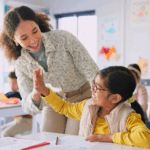 teacher practicing positive behavioral interventions with student